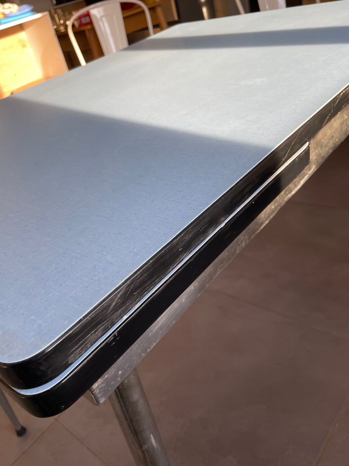 Blue Formica table for 4 to 6 people