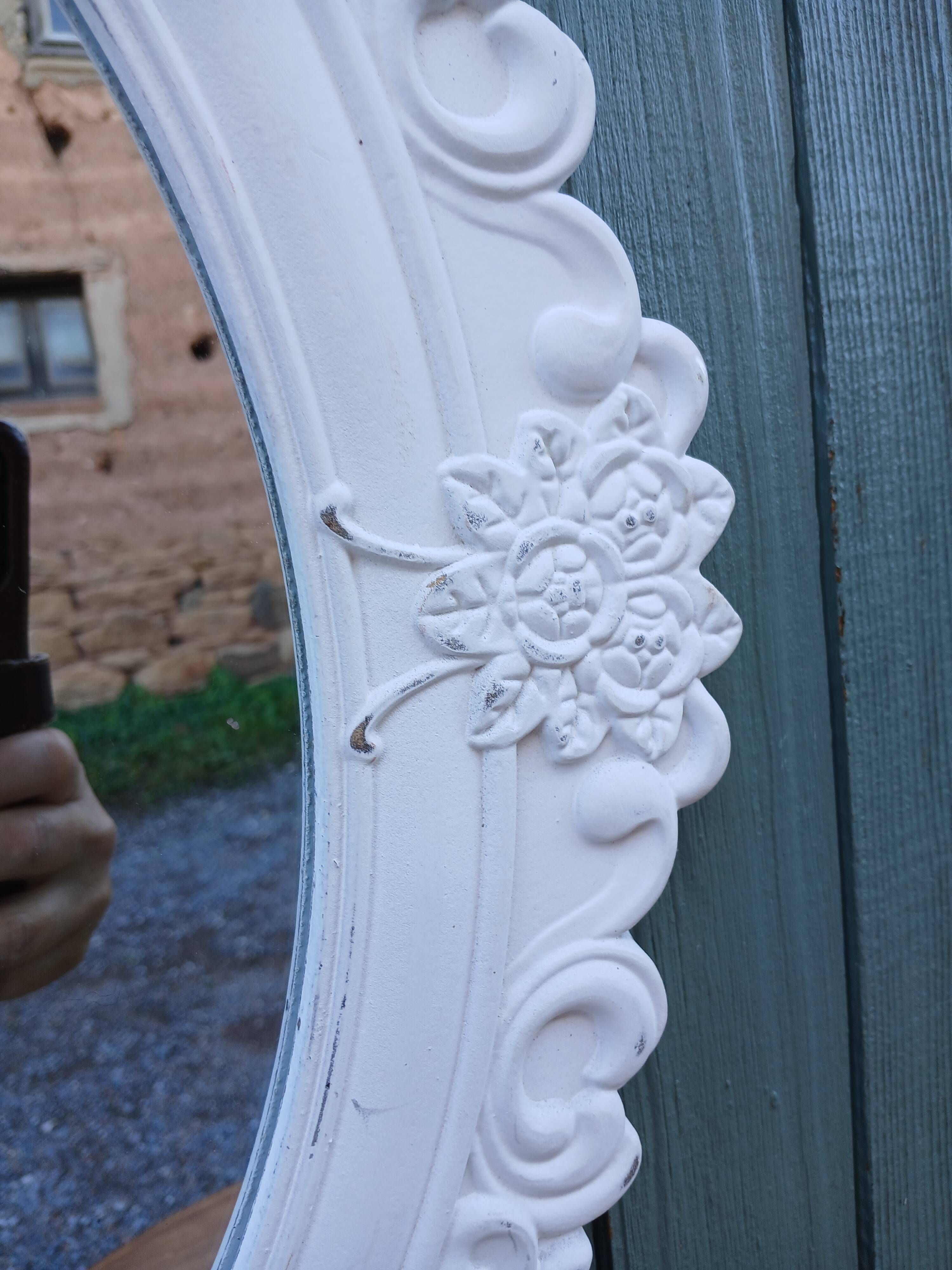 Oval mirror with white frame