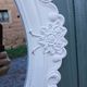 Oval mirror with white frame