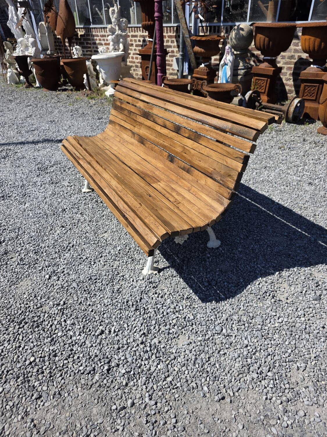 Antique garden bench made of cast iron and oak slats