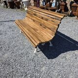 Antique garden bench made of cast iron and oak slats