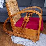 Ancien fauteuil bas colonial style Art Déco en bois.