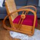 Ancien fauteuil bas colonial style Art Déco en bois.