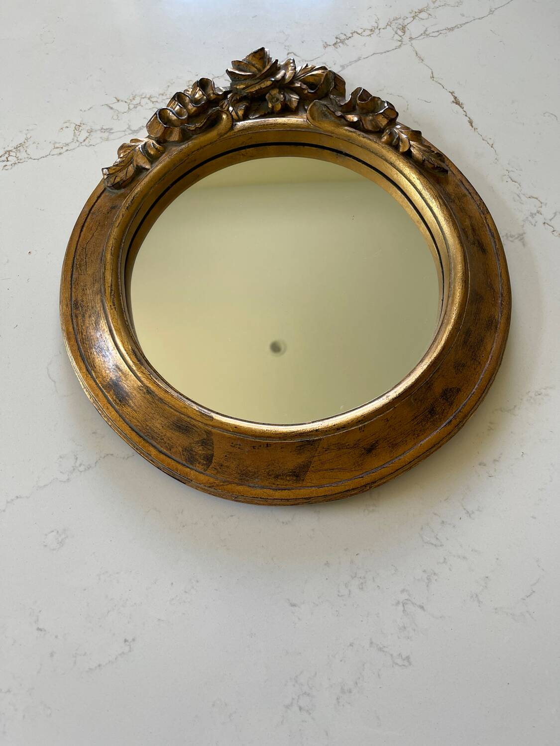 Round carved wooden mirror