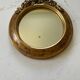 Round carved wooden mirror