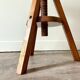 Tabouret tripode à vis en bois