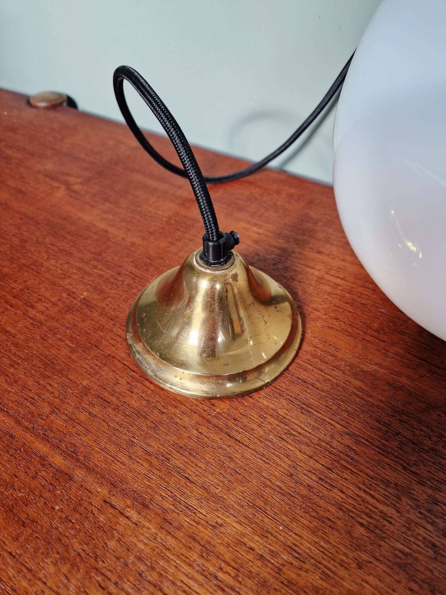 Large bulbous pendant light in white opaline and brass