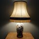 Ceramic lamp with Asian decoration with matching lampshade.