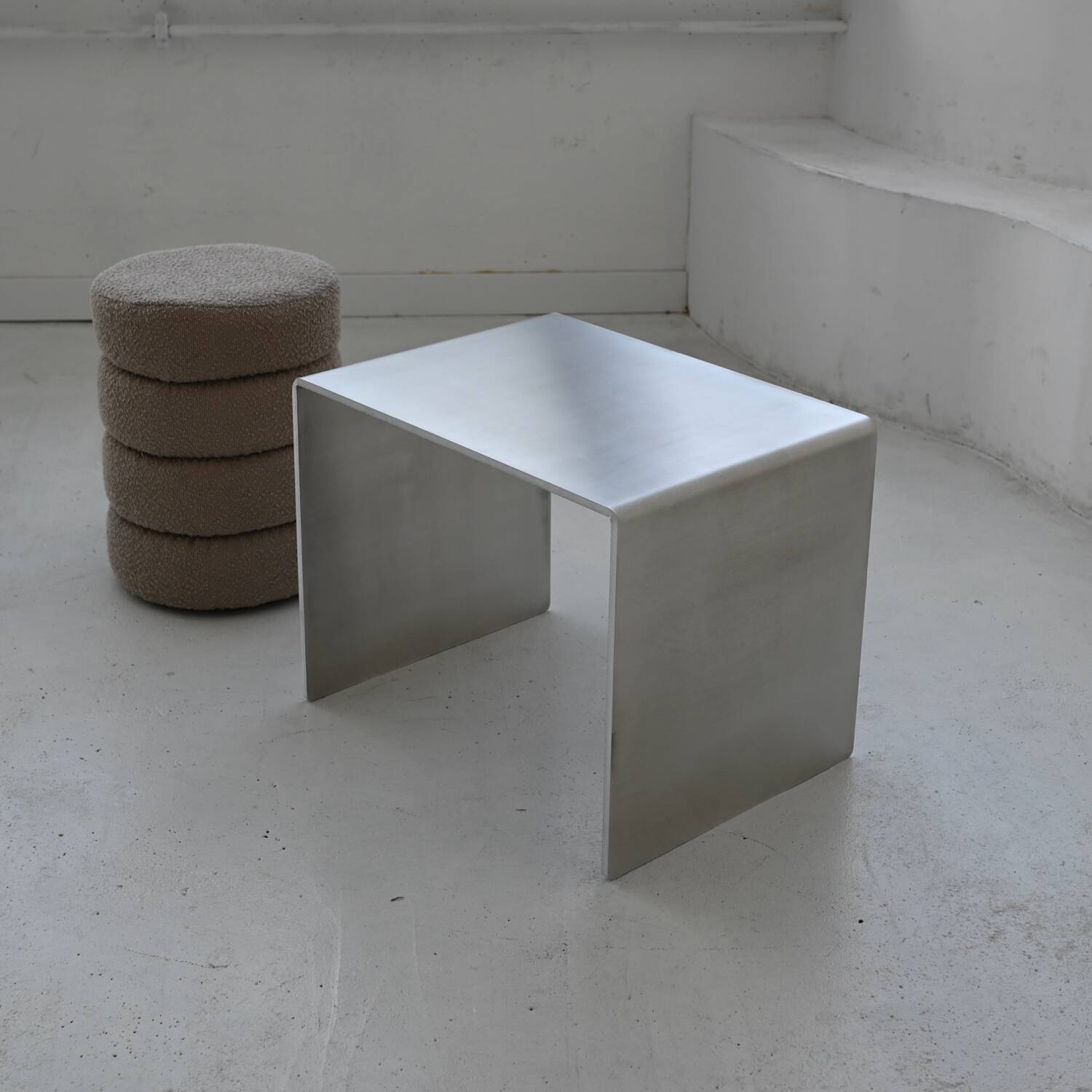 Minimalist brushed aluminum side table
