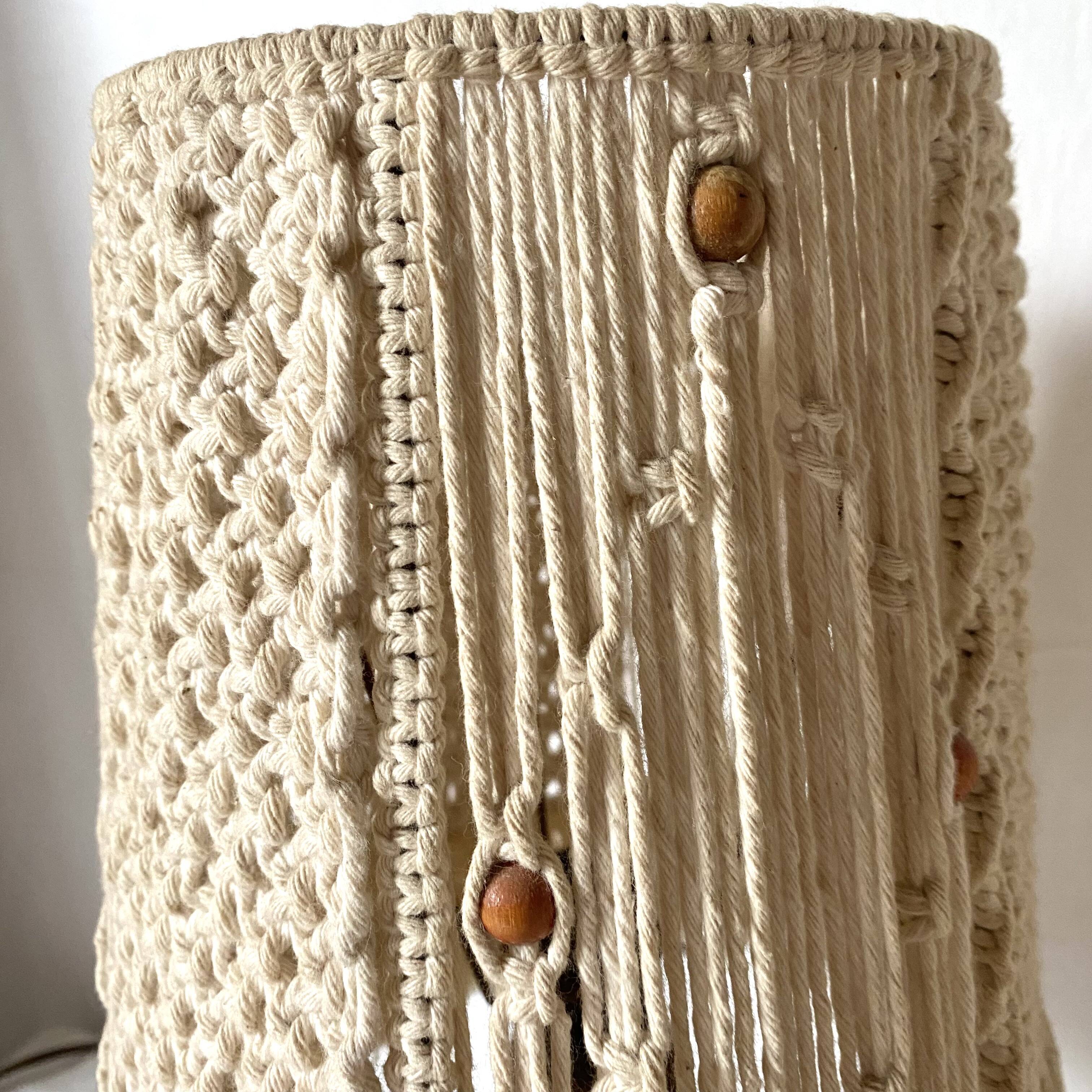 Pair of carved wood and macramé bedside lamps