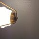 Danish hanging lamp from the 50-60s, made of brass, metal and with milky white glass shade.