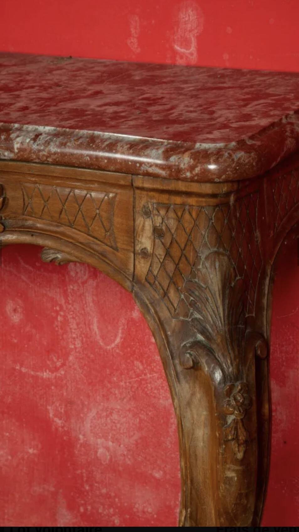 Important console in natural wood, moulded and carved with a red marble top.