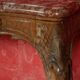 Important console in natural wood, moulded and carved with a red marble top.