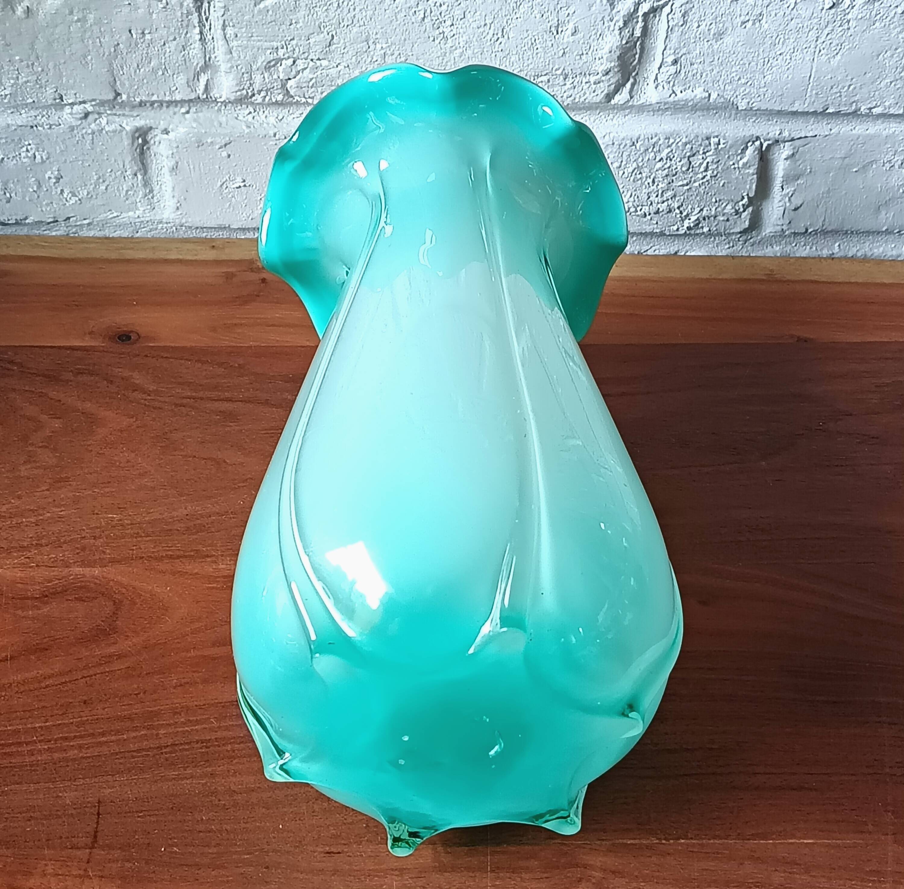Large light blue opaline vase with a wavy neck.