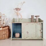 Small old wall shelf with sliding doors