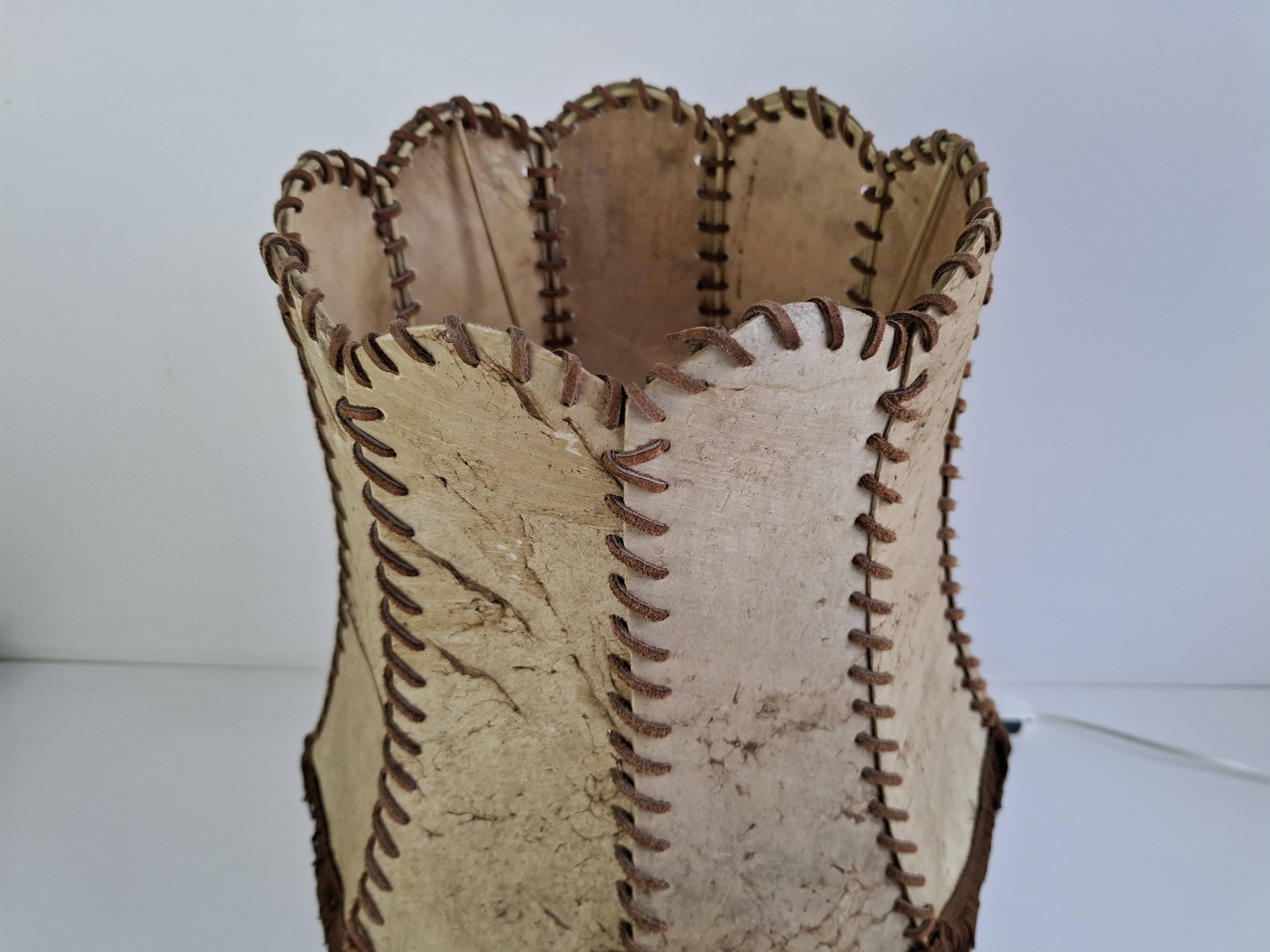 Vintage ceramic table lamp with hand-stitched leather shade, 1980s.