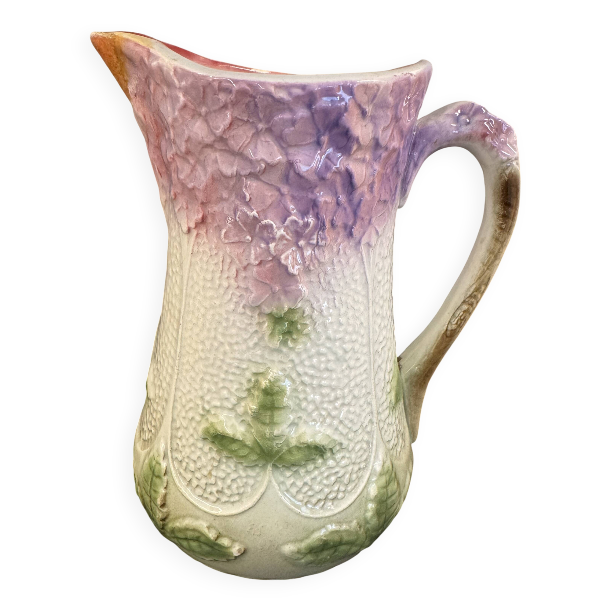 Old majolica jug with mauve floral decoration