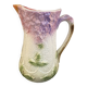 Old majolica jug with mauve floral decoration