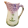 Old majolica jug with mauve floral decoration
