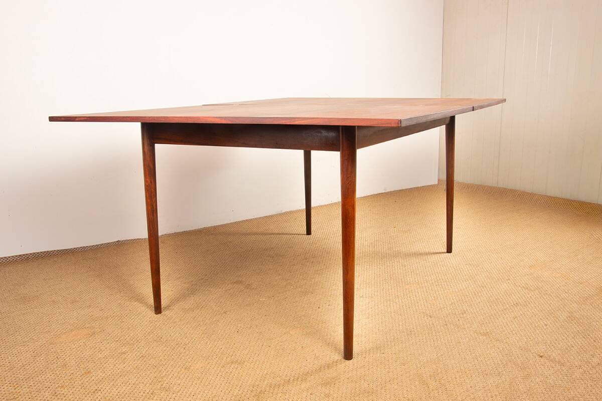 Danish extendable dining table in rosewood and brass by Poul Volther