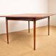 Danish extendable dining table in rosewood and brass by Poul Volther