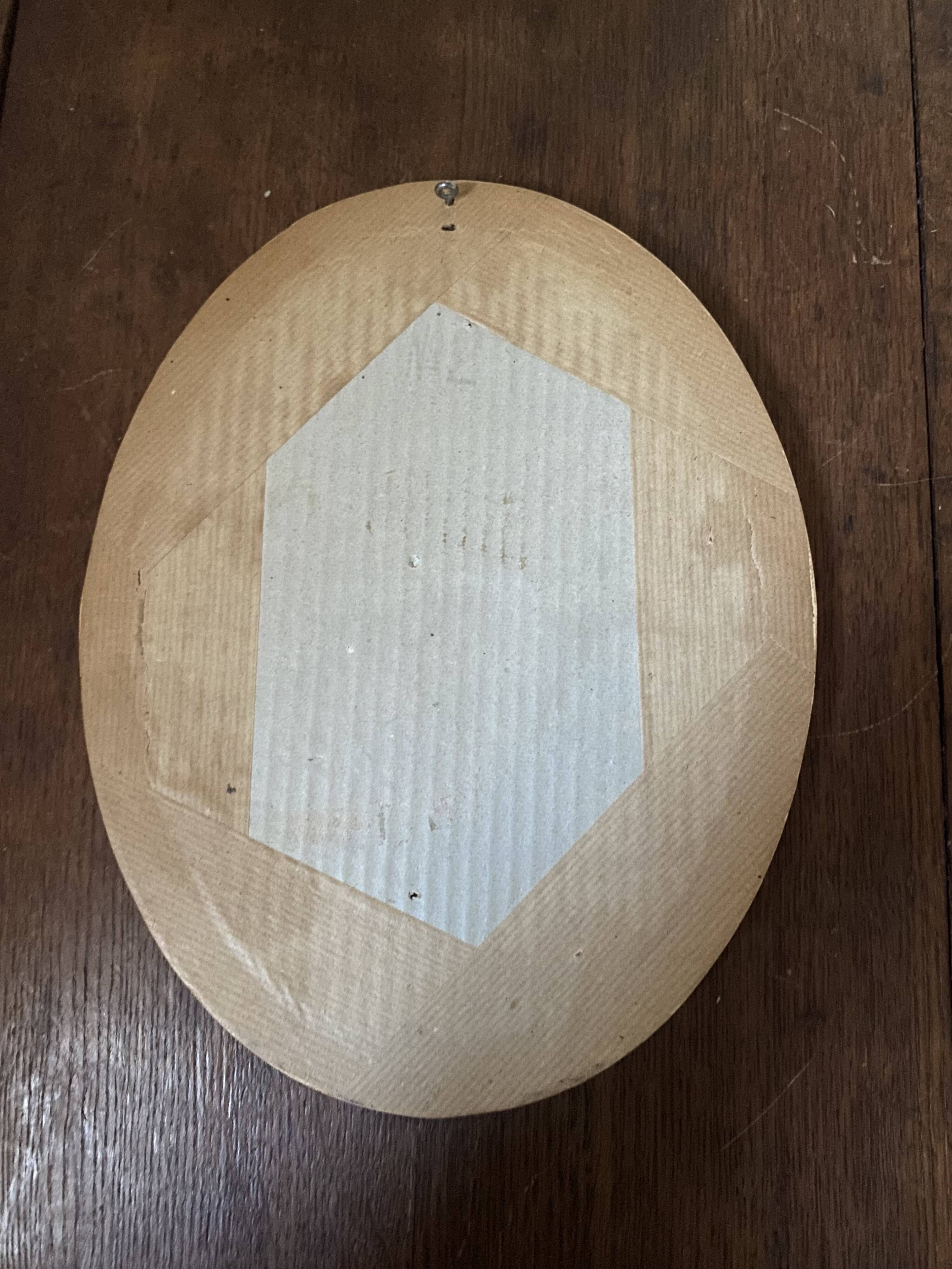 Classic oval mirror in gilded wood.