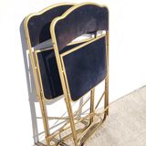 Pair of black and gold folding opera chairs