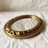 Small vintage wall mirror in gold resin