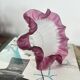 Antique tulip lampshade in transparent glass with a red rim.