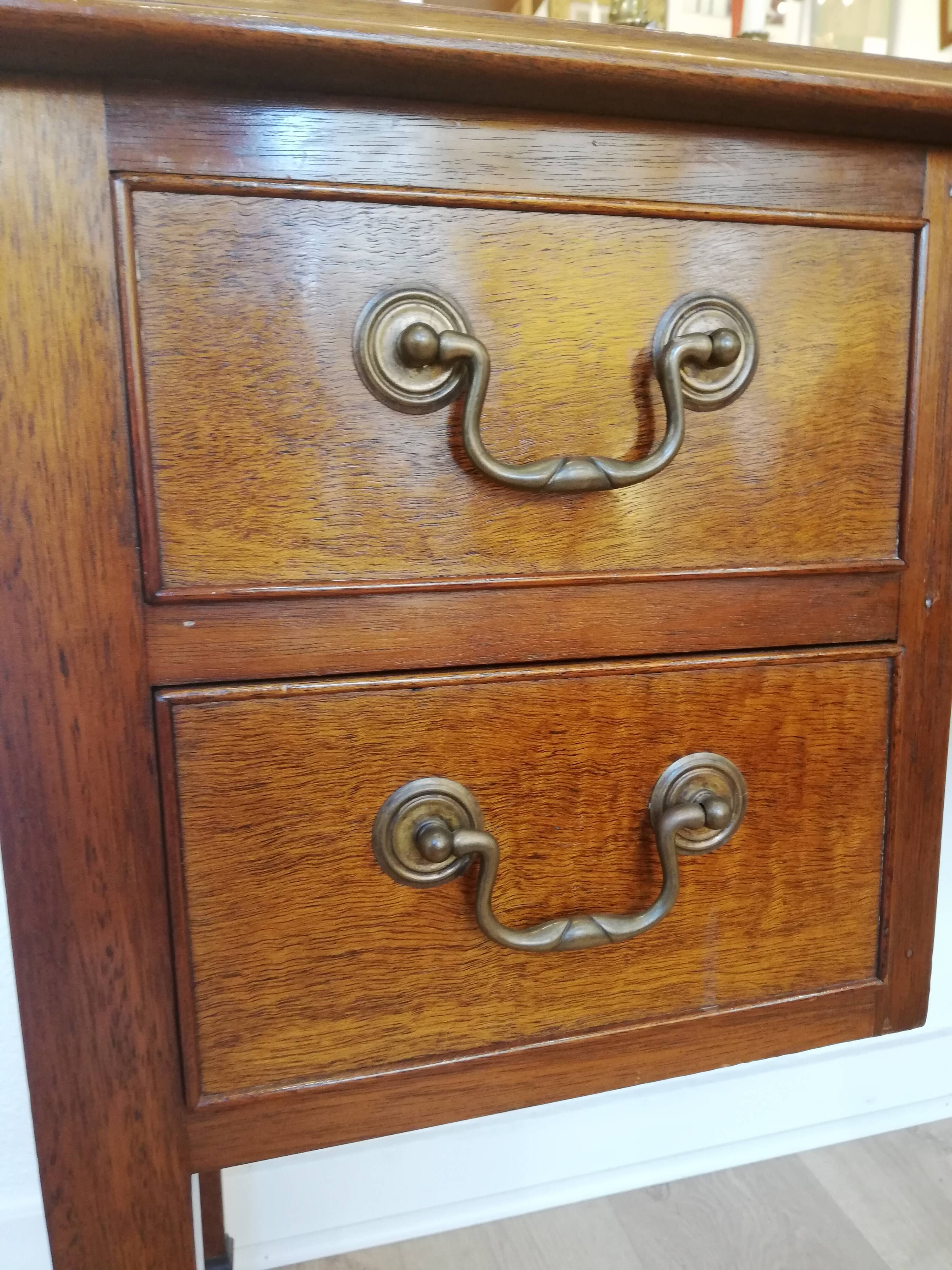 English wooden desk on top of leather