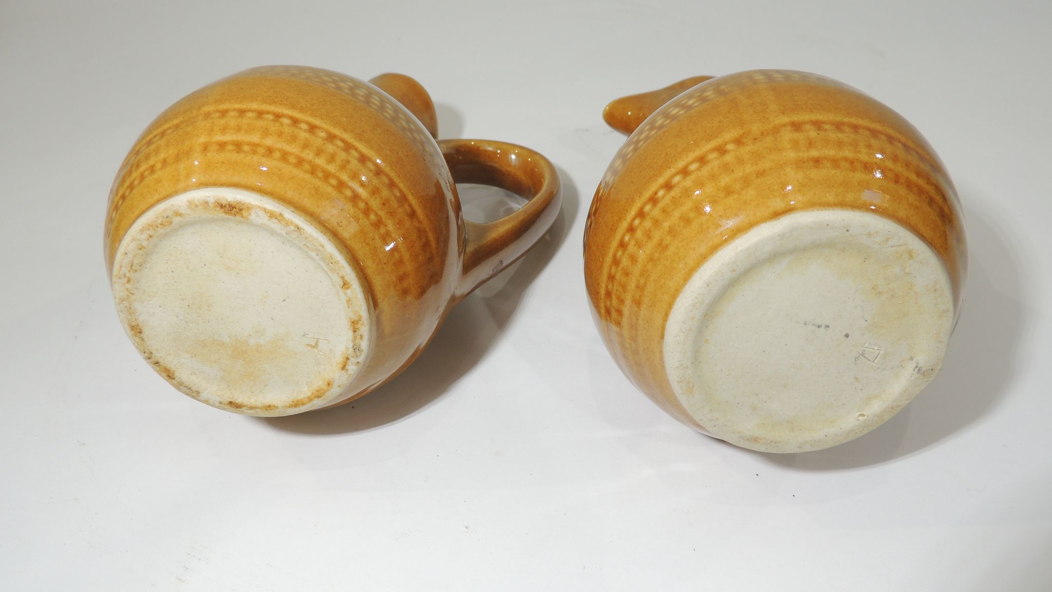 Pair of vintage stoneware pitchers