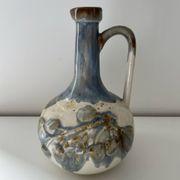 Cherry-decorated earthenware carafe