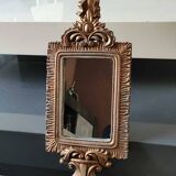 Louis XVI/Baroque style rectangular mirror. In polyresin with golden patina/Cérusée. Fronton knot. Dim. 47 x 14 cm