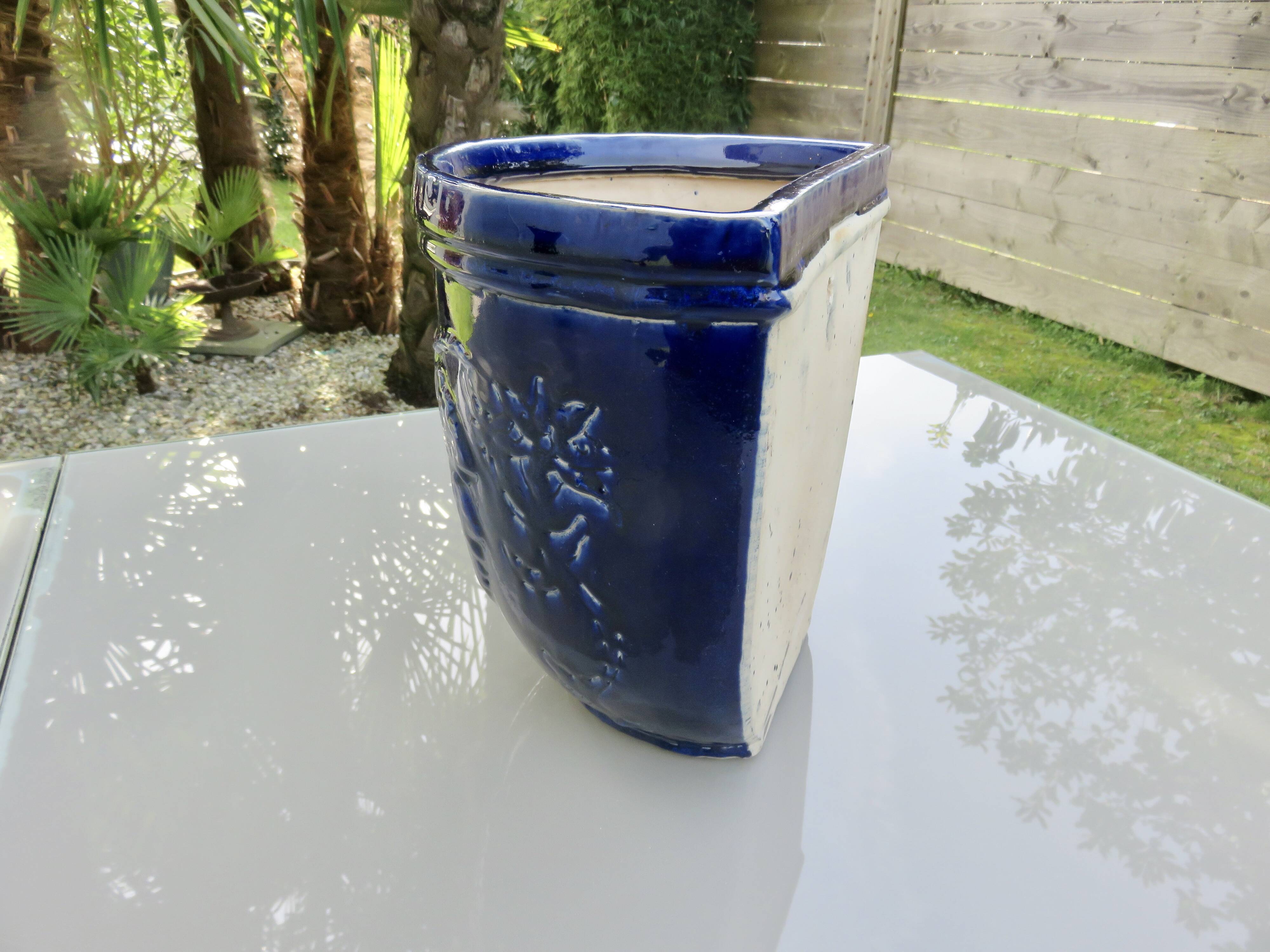 Wall pot in glazed blue terracotta with a grape motif, 1970s.