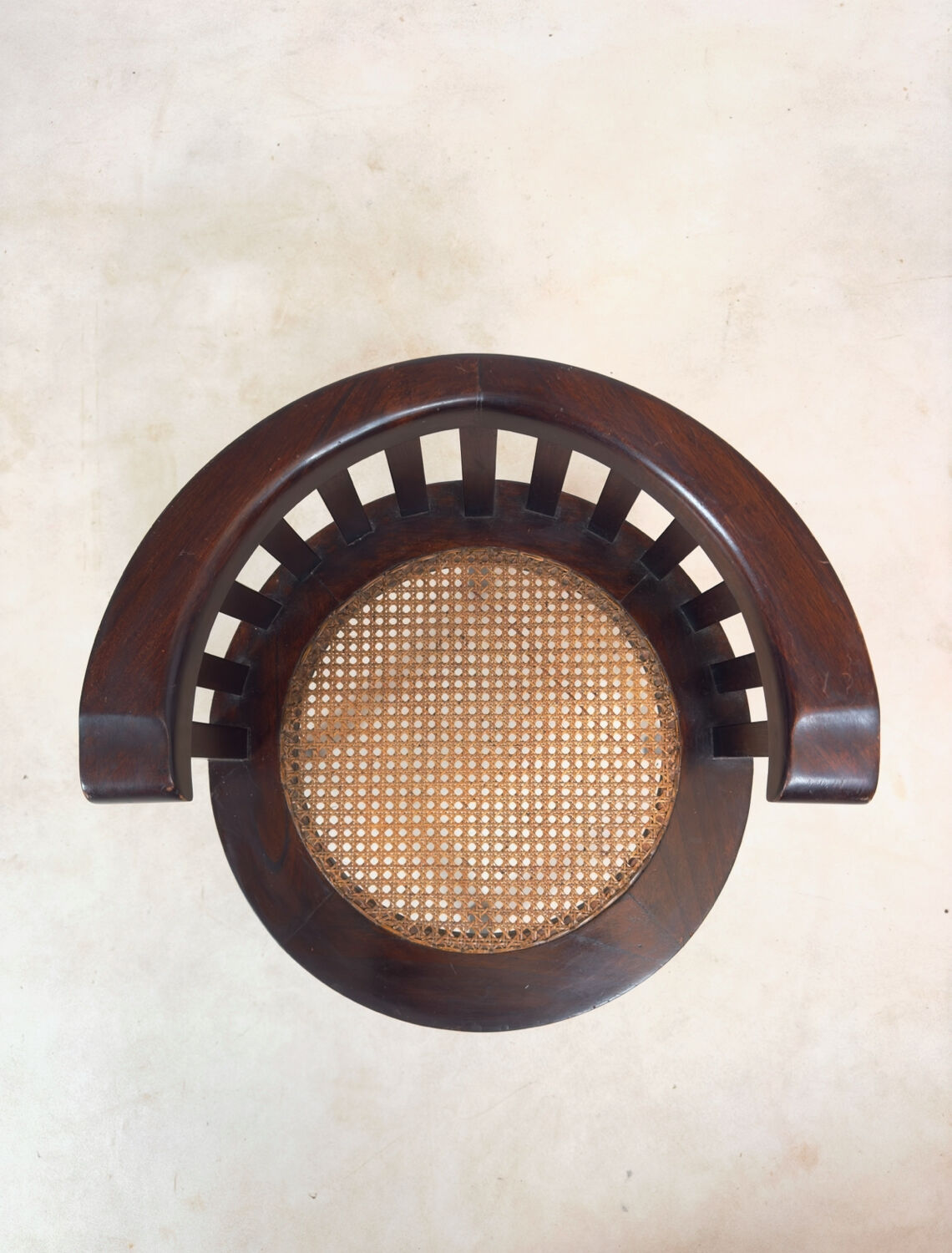 Colonial "Art Deco" armchair in wood and cane.