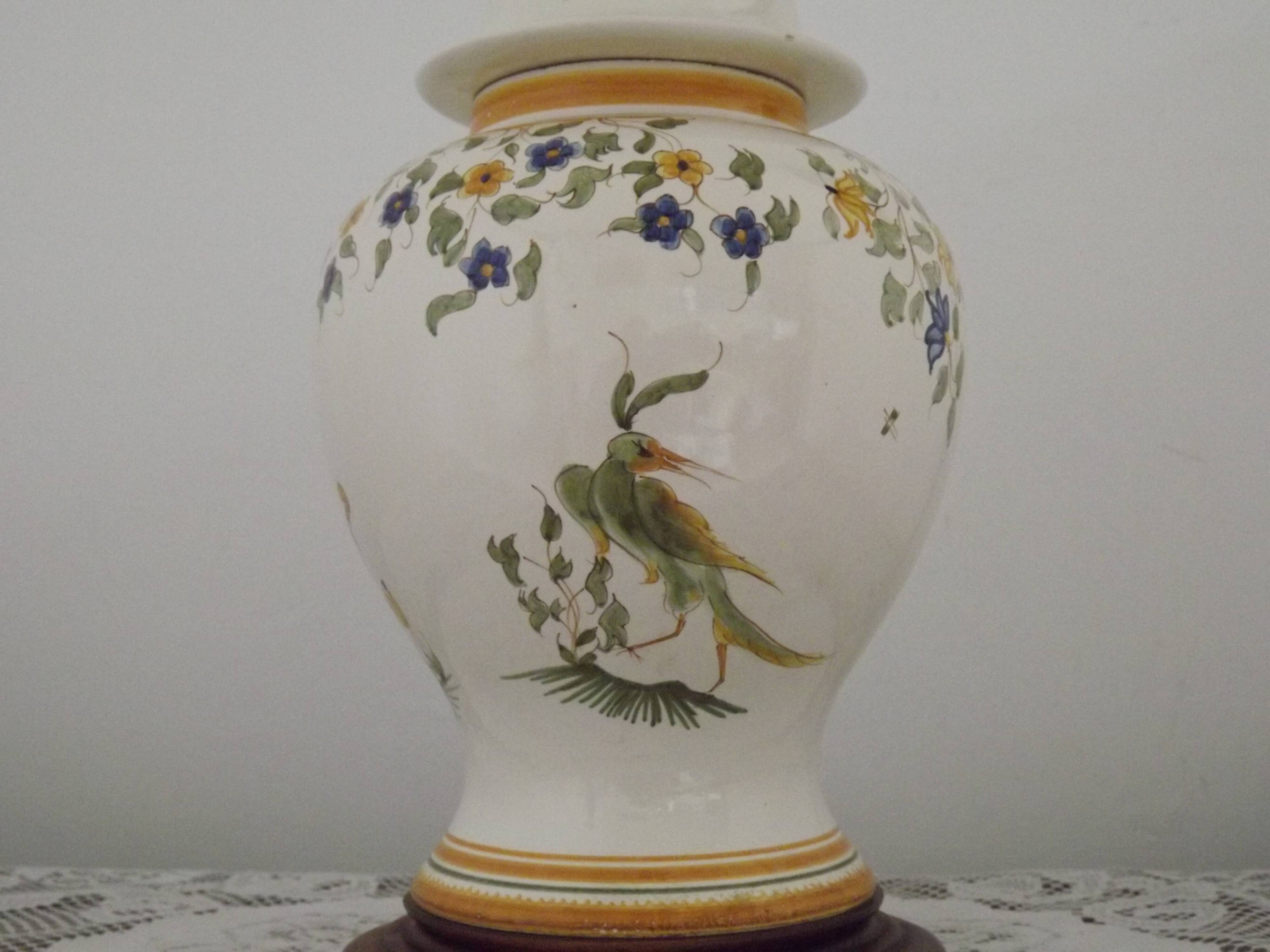 Table lamp with wooden base and fringed shade