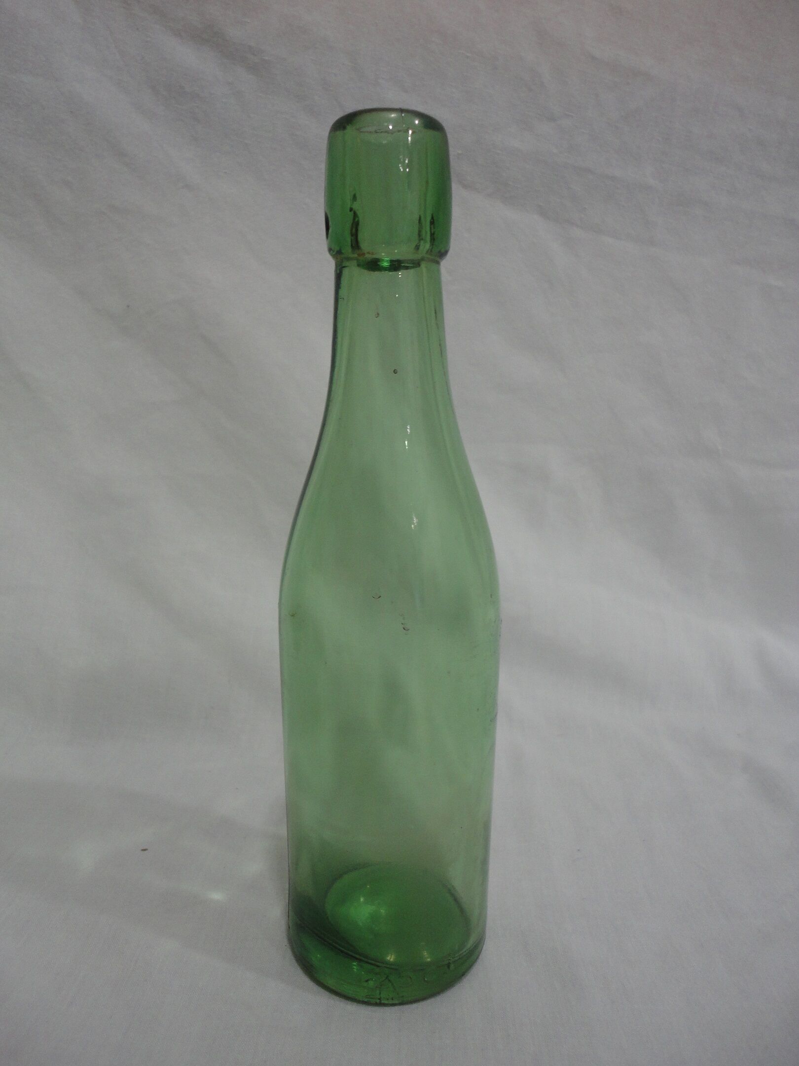Series of 6 old glass soda bottles