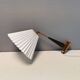 Wall lamp with adjustable ‘arm’ in copper and rosewood, with white shade.