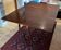 Table en acajou vintage à rabats; idéale pour les décorateurs.