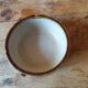 Old small glazed ceramic dish with lion head decoration - brown enamel kitchen bowl
