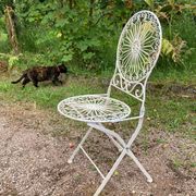 Foldable medallion garden chair from the 20th century in wrought iron with Heart motifs