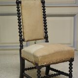 Pair of low armchairs in blackened wood
