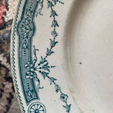 3 flat plates in ironstone with a floral green border.