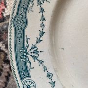 3 flat plates in ironstone with a green floral border