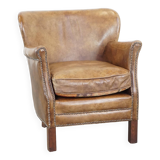 Nice, subtle cowhide armchair with a reversible kilim seat cushion