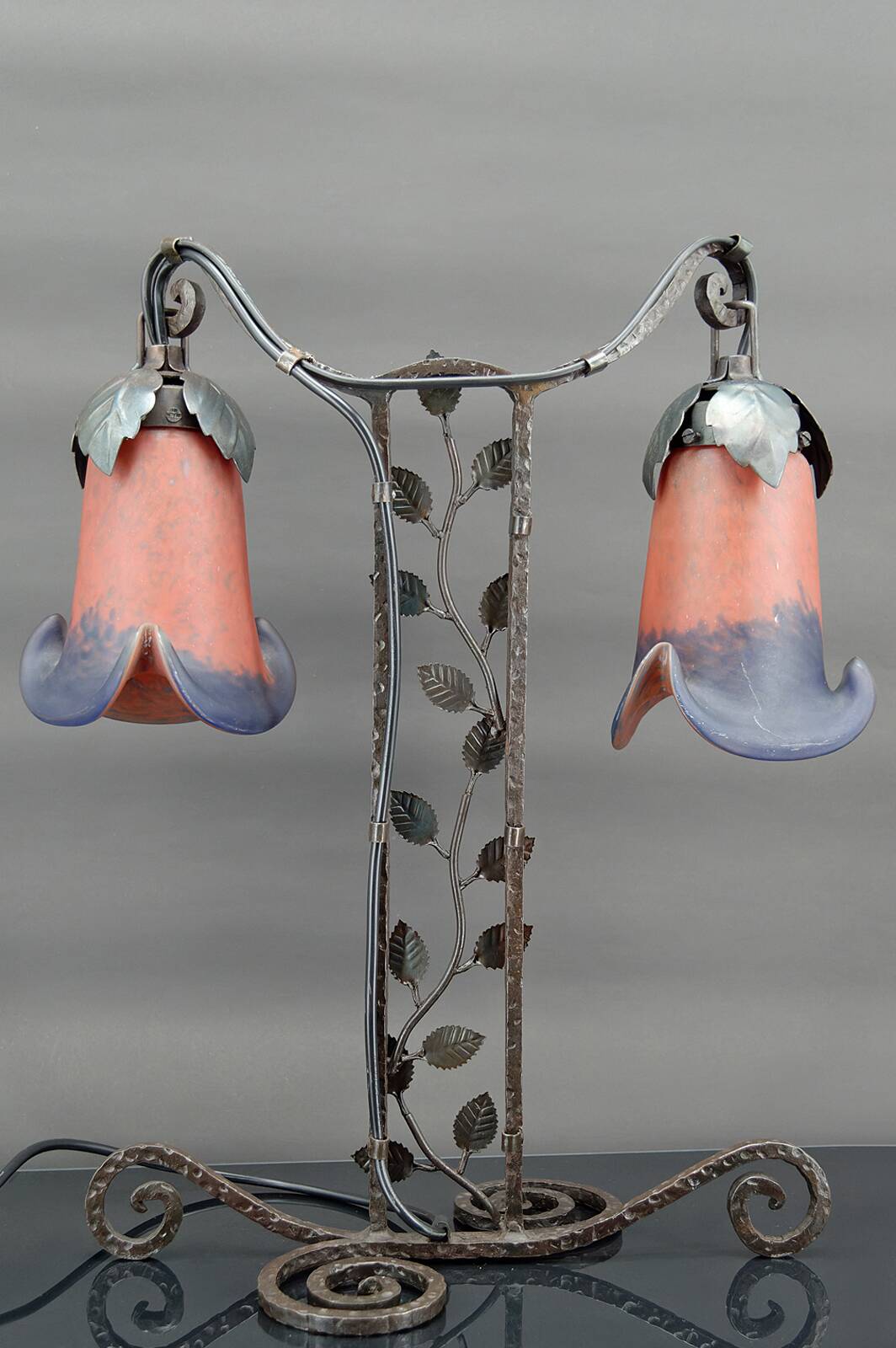 Two-headed wrought iron lamp by Muller, Art Deco, France, Circa 1920