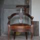 Barber chair in wood and leather with adjustable headrest, office chair.