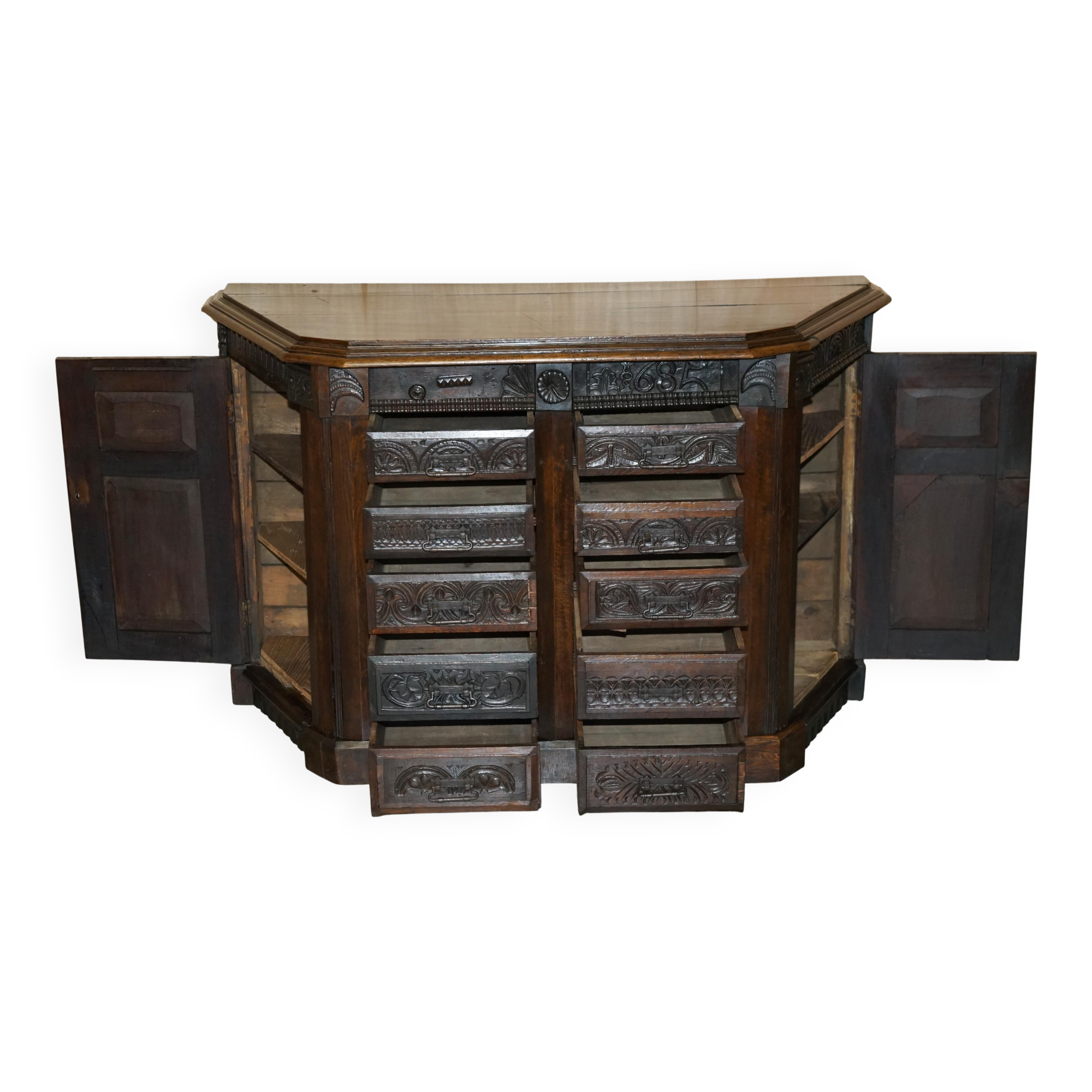 Hand-carved commode from 1685 with sideboards and side cupboards.