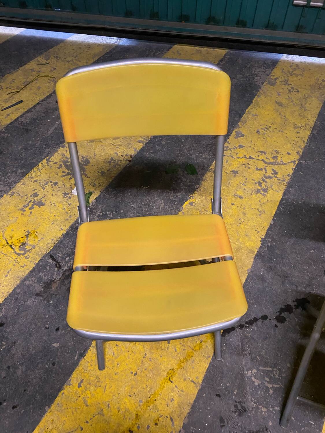 Yellow plastic and steel folding chairs, 1970s
