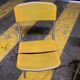 Yellow plastic and steel folding chairs, 1970s